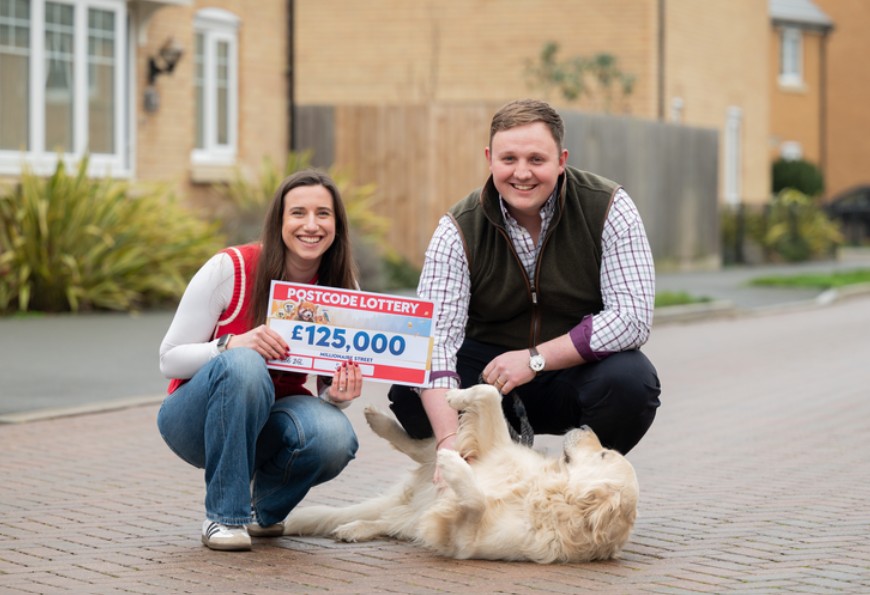 PAWSOME: Winner Megan Jeacock with hubby Ben and four-year-old retriever Gatsby