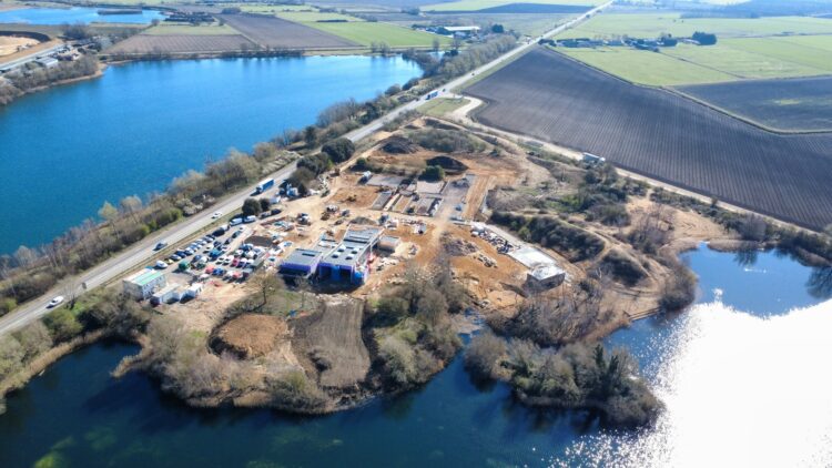 Aerial view of Lake View Bereavement Centre under construction in March 2026, showing the emerging butterfly-shaped chapel, landscaped grounds, and preserved natural features. IMAGE: East Cambridgeshire District Council