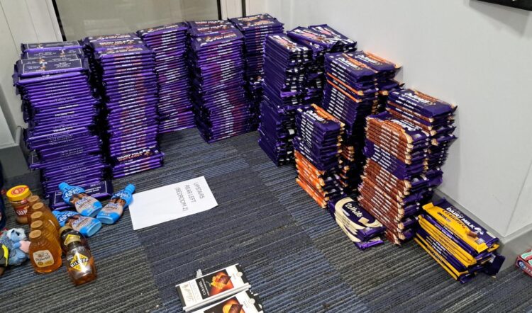Police recover nearly 3,000 stolen chocolate and confectionery items worth over £7,000 in Fenstanton. Edgware couple arrested and bailed with restrictions in Cambridgeshire. Photos of goods seized by Cambridgeshire Police