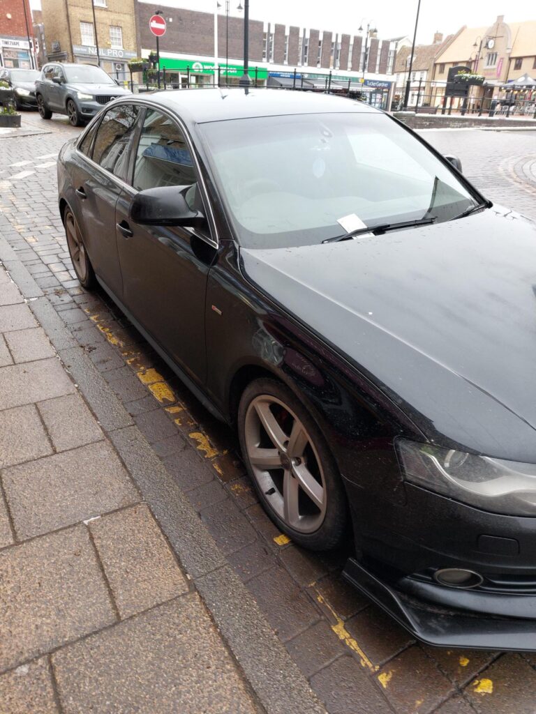 Police officers issue parking tickets during a targeted enforcement operation in Ely, highlighting the continued reliance on limited police resources in the absence of civil parking enforcement across East Cambridgeshire. PHOTO: Policing East Cambridgeshire