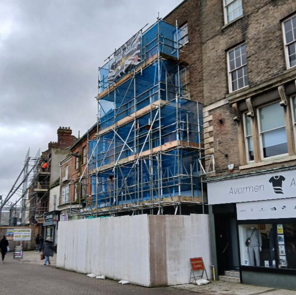 Image above from Fenland District Council: The scaffold-clad former Franks butchers, at 10 Market Place, Wisbech (February 2026)