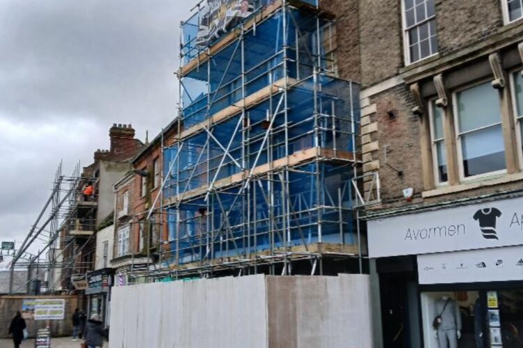 Image above from Fenland District Council: The scaffold-clad former Franks butchers, at 10 Market Place, Wisbech (February 2026)