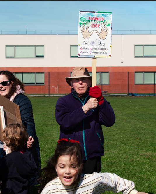 Supporters of the Save Werrington Fields campaign gather in large numbers on Saturday, calling on Peterborough City Council to delay its decision and reopen transparent talks over the future of the community green space. PHOTO: John Wallis
