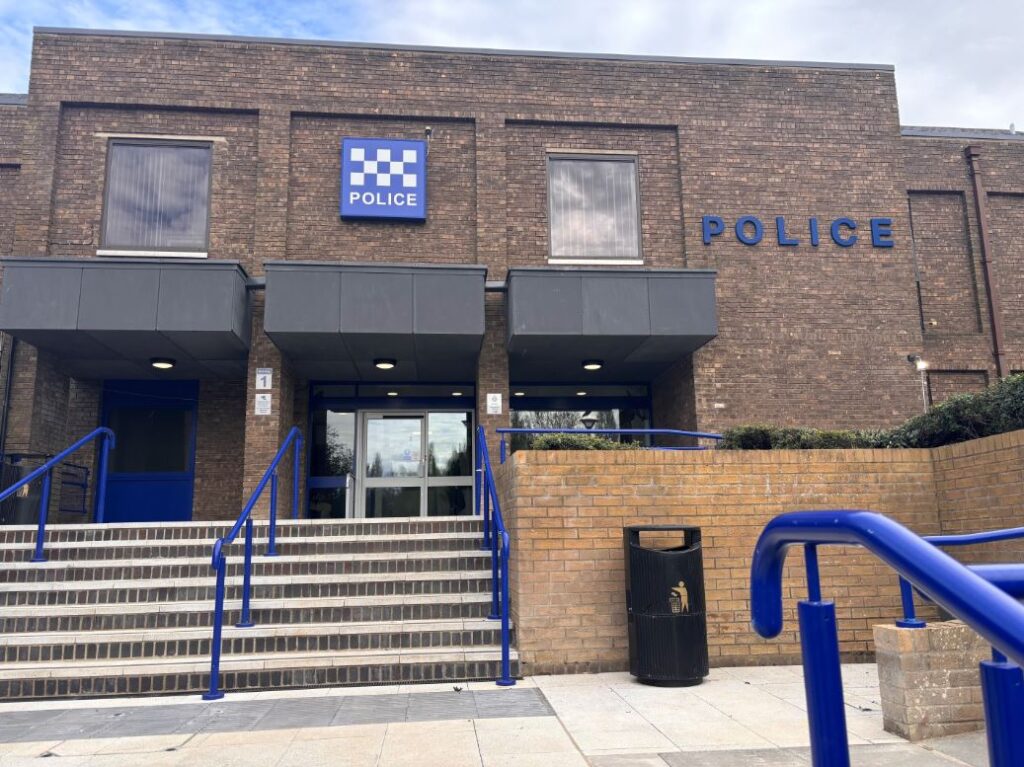 Thorpe Wood Police Station in Peterborough, where a 66-year-old man arrested on suspicion of fraud and misconduct in public office in December 2025 was taken into custody before being released on bail, now extended until June 2026.