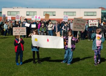 Supporters of the Save Werrington Fields campaign gather in large numbers on Saturday, calling on Peterborough City Council to delay its decision and reopen transparent talks over the future of the community green space. PHOTO: John Wallis