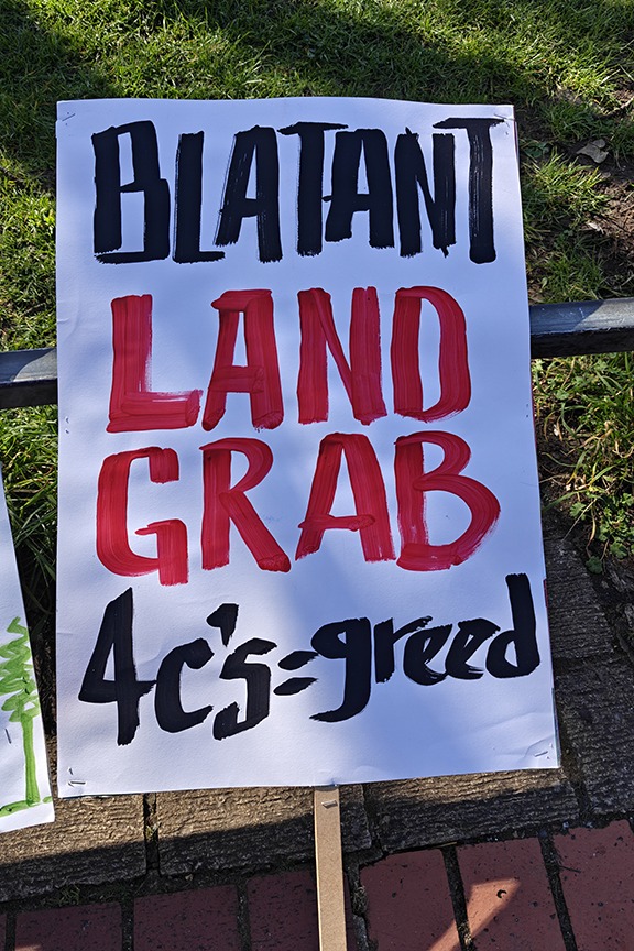 Supporters of the Save Werrington Fields campaign gather in large numbers on Saturday, calling on Peterborough City Council to delay its decision and reopen transparent talks over the future of the community green space. PHOTO: Paul Saunders