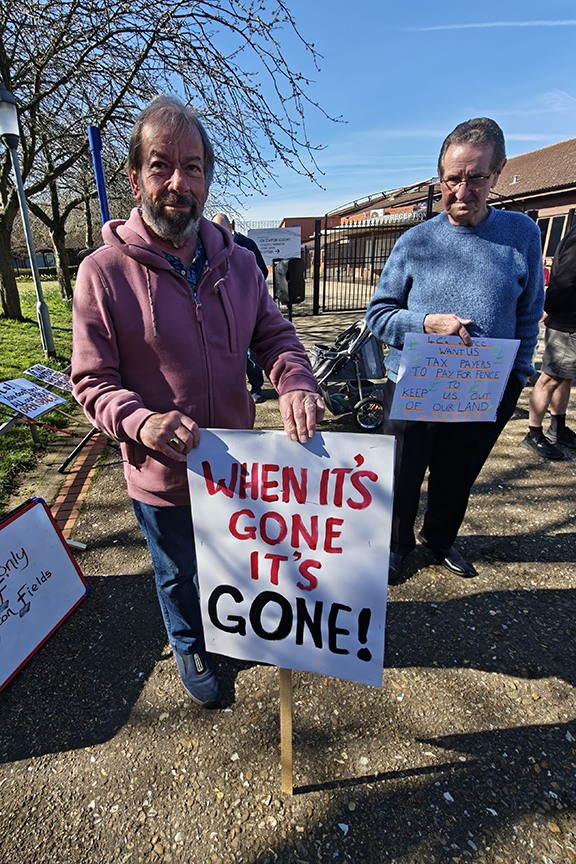 Supporters of the Save Werrington Fields campaign gather in large numbers on Saturday, calling on Peterborough City Council to delay its decision and reopen transparent talks over the future of the community green space. PHOTO: Paul Saunders