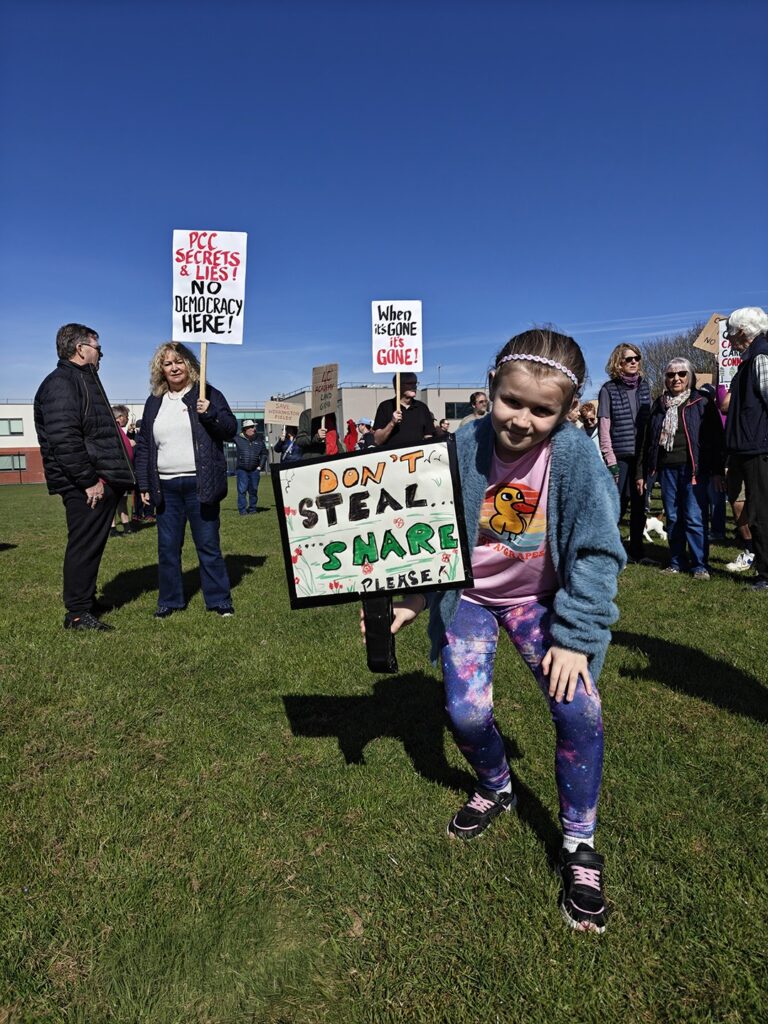 Supporters of the Save Werrington Fields campaign gather in large numbers on Saturday, calling on Peterborough City Council to delay its decision and reopen transparent talks over the future of the community green space. PHOTO: Paul Saunders