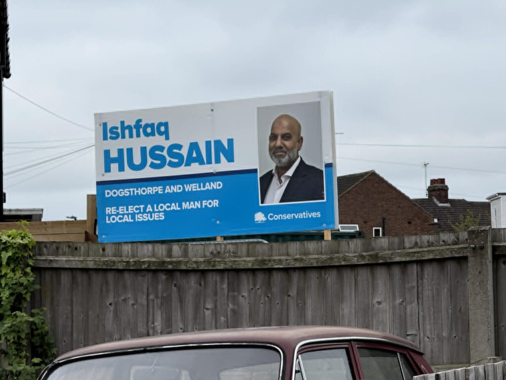 Election posters across Peterborough still show Ishfaq Hussain as the Conservative candidate for Dogsthorpe, despite the party withdrawing support ahead of the May 7 local elections IMAGE: CambsNews