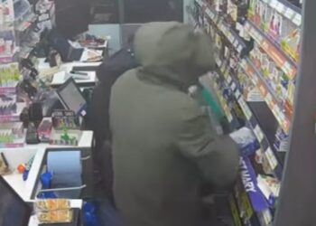 CCTV image taken from police YouTube footage shows masked raiders entering the Post Office and Premier Store in Eaton Socon, St Neots, moments before the burglary.