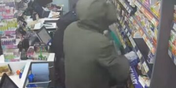 CCTV image taken from police YouTube footage shows masked raiders entering the Post Office and Premier Store in Eaton Socon, St Neots, moments before the burglary.