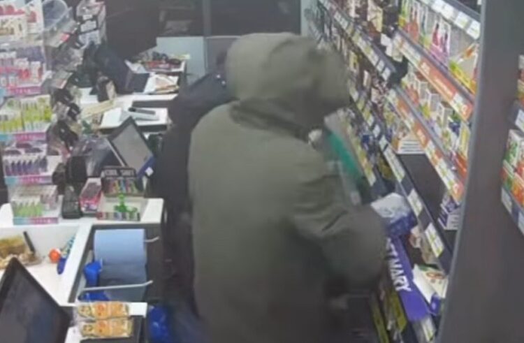 CCTV image taken from police YouTube footage shows masked raiders entering the Post Office and Premier Store in Eaton Socon, St Neots, moments before the burglary.