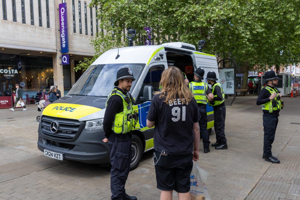 • Officers speak to a member of the public near Bridge Street during Saturday’s facial recognition operation. Photo: Terry Harris/CambsNews