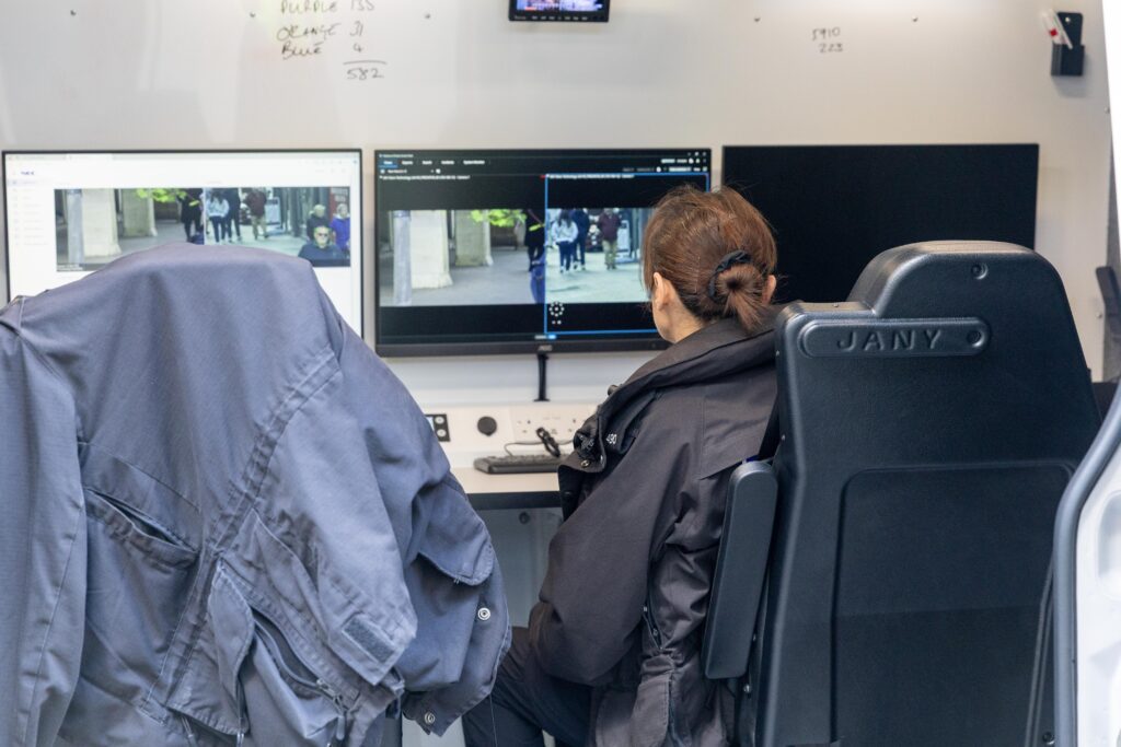 • Police officers monitor live facial recognition technology in Peterborough city centre during Cambridgeshire’s first deployment of the system. Photo: Terry Harris/CambsNews