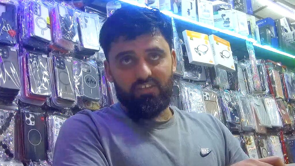 Undercover BBC footage captured inside Afg Mobile Repair in Woolwich, south-east London, during an investigation into alleged payments linked to illegal Channel crossings. Credit: BBC Local Investigations
