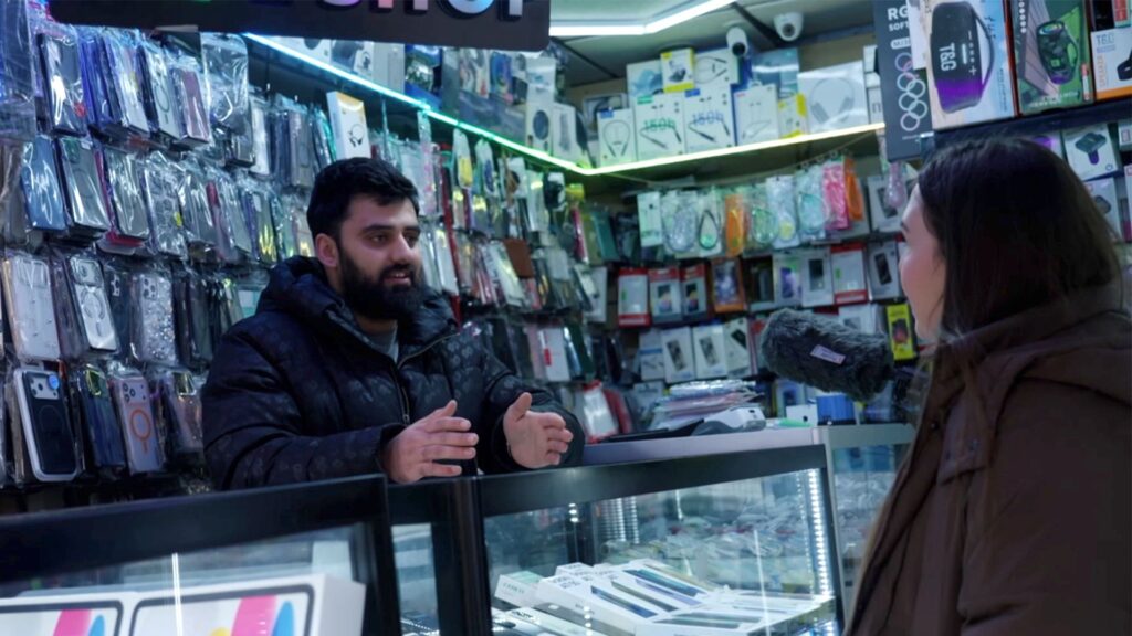 Undercover BBC footage captured inside Afg Mobile Repair in Woolwich, south-east London, during an investigation into alleged payments linked to illegal Channel crossings. Credit: BBC Local Investigations