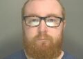 Custody image of Ben Sharpe, 31, who has been jailed for child abuse image offences and breaching a Sexual Harm Prevention Order.