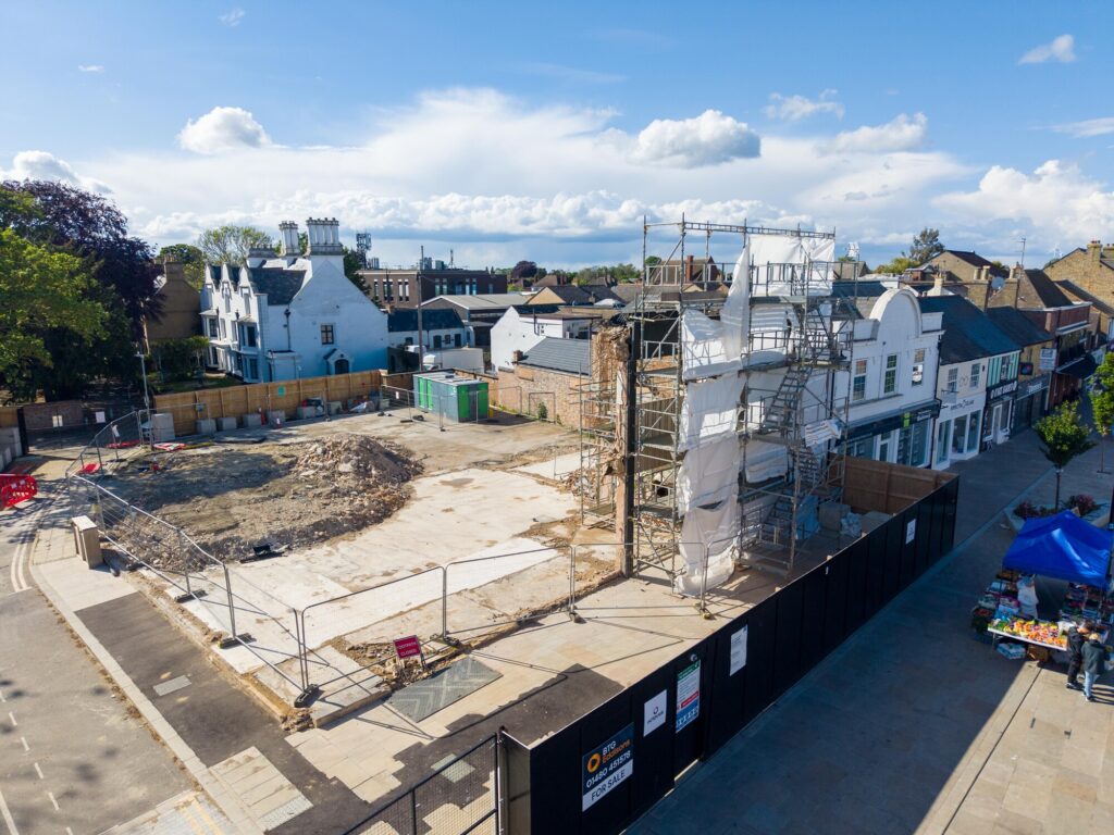 Exposed masonry and structural supports remain visible at the former Barclays Bank site in March as engineers grapple with unforeseen demolition complications. Photo: Terry Harris/CambsNews
