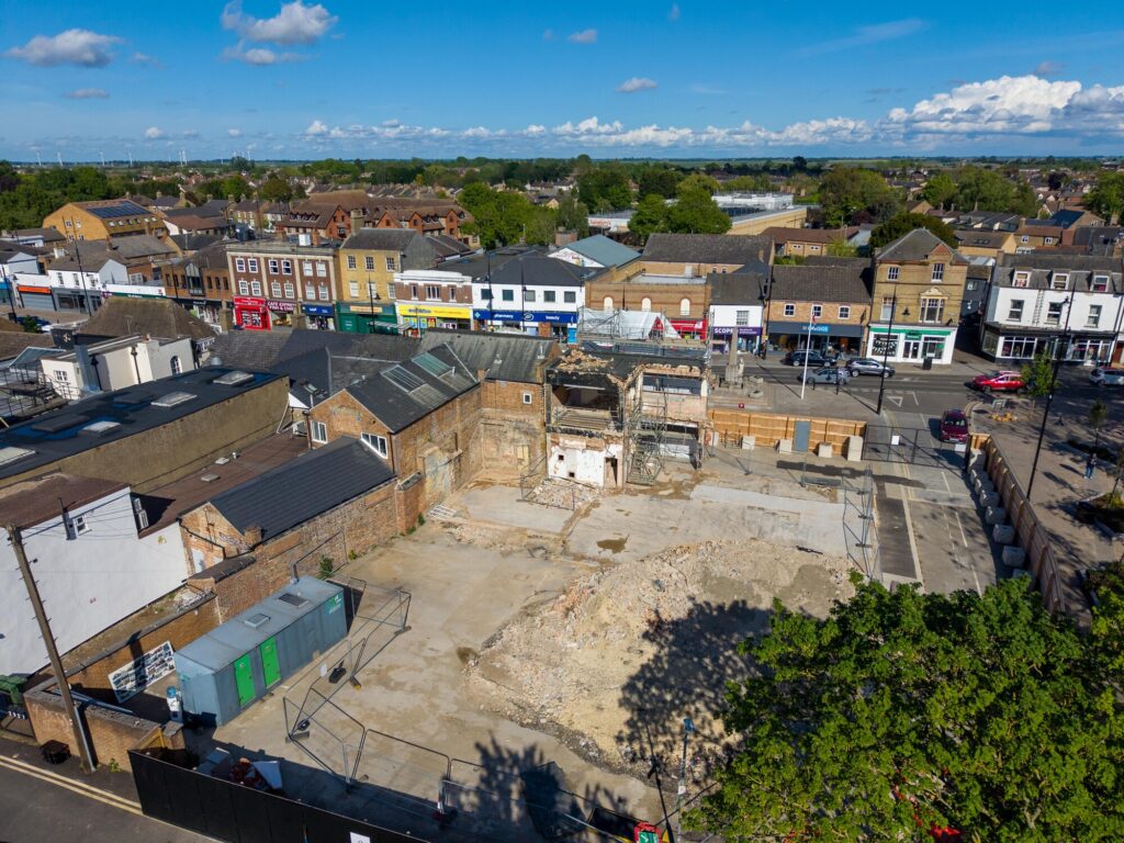 Exposed masonry and structural supports remain visible at the former Barclays Bank site in March as engineers grapple with unforeseen demolition complications. Photo: Terry Harris/CambsNews