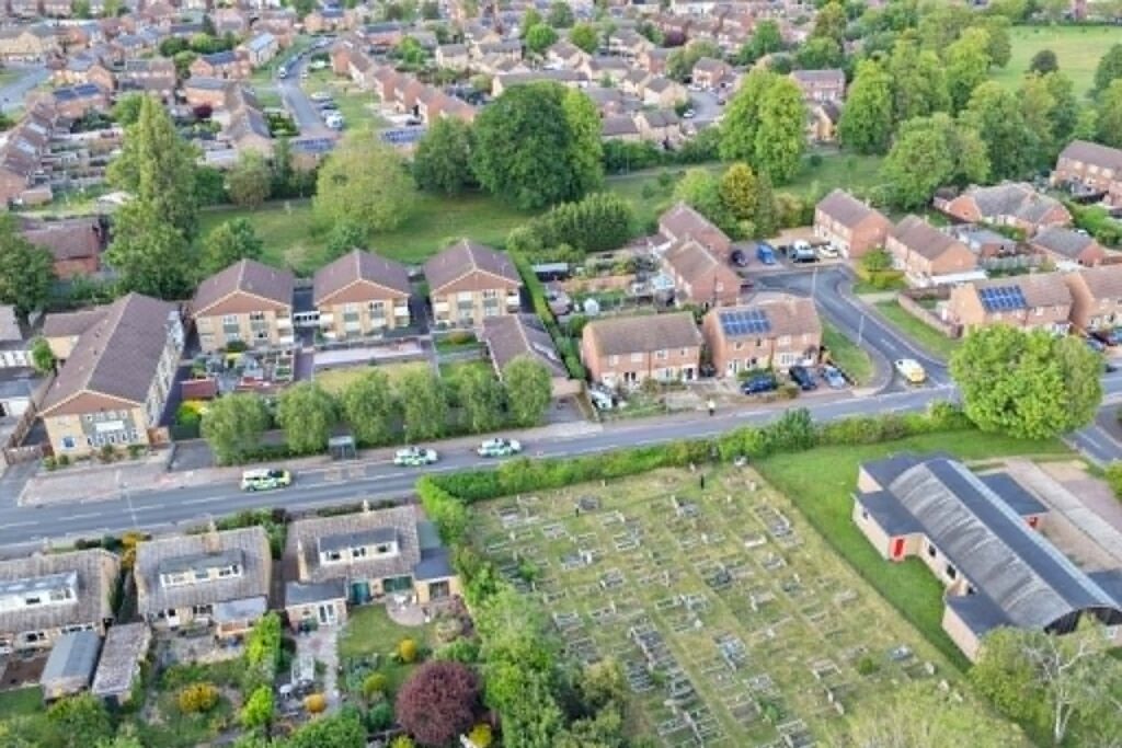 An aerial view of the extensive damage after a car ploughed into a semi-detached property in Paston Ridings, Peterborough, prompting a major emergency response.