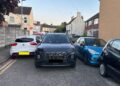 A Cambridgeshire Fire and Rescue Service emergency vehicle squeezes between tightly parked cars on Victoria Street in Fletton while crews respond to a house fire in Peterborough. PHOTO: Cambridgeshire Fire and Rescue