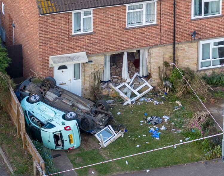 Extensive damage is seen after a blue Ford Mondeo crashed into a house in Paston Ridings, Peterborough, leaving two people seriously injured. Photo: Terry Harris/CambsNew