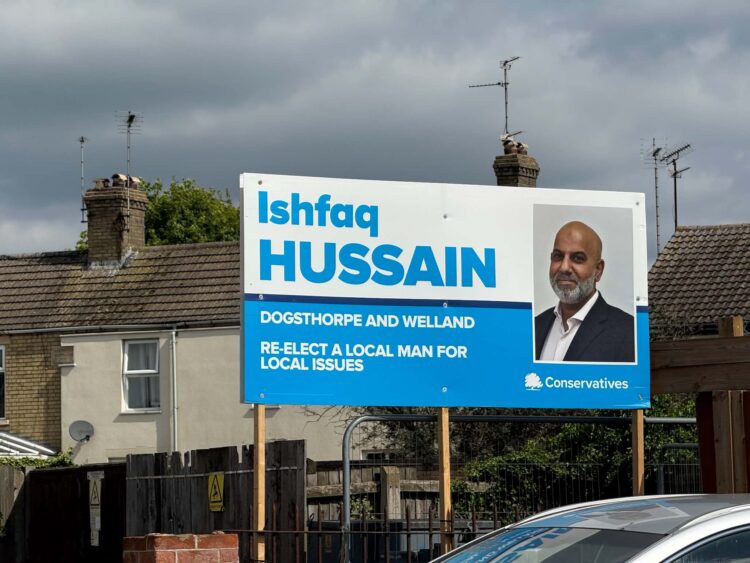 Campaign posters showing suspended candidate Ishfaq Hussain as the Conservative choice remained on display across Peterborough on polling day. Picture: CambsNews