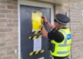 Police officers secure a closure order at 2B Mallard Lane, St Neots, following repeated reports of anti-social behaviour linked to the property. The order was granted by Peterborough Magistrates’ Court on 13 May.