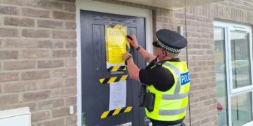 Police officers secure a closure order at 2B Mallard Lane, St Neots, following repeated reports of anti-social behaviour linked to the property. The order was granted by Peterborough Magistrates’ Court on 13 May.